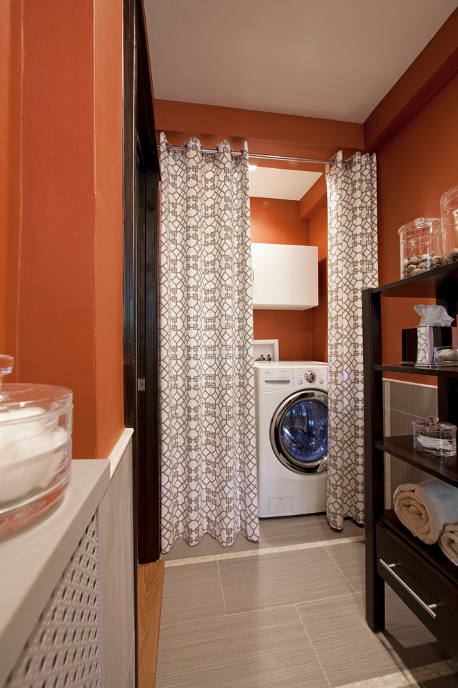 Design ideas for a contemporary laundry room in Chicago with orange walls.
