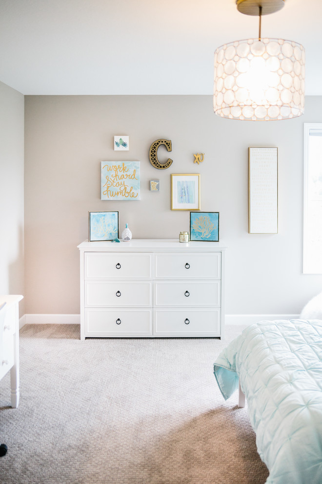 This is an example of a mid-sized beach style kids' bedroom for kids 4-10 years old and girls in Minneapolis with green walls, carpet and brown floor.