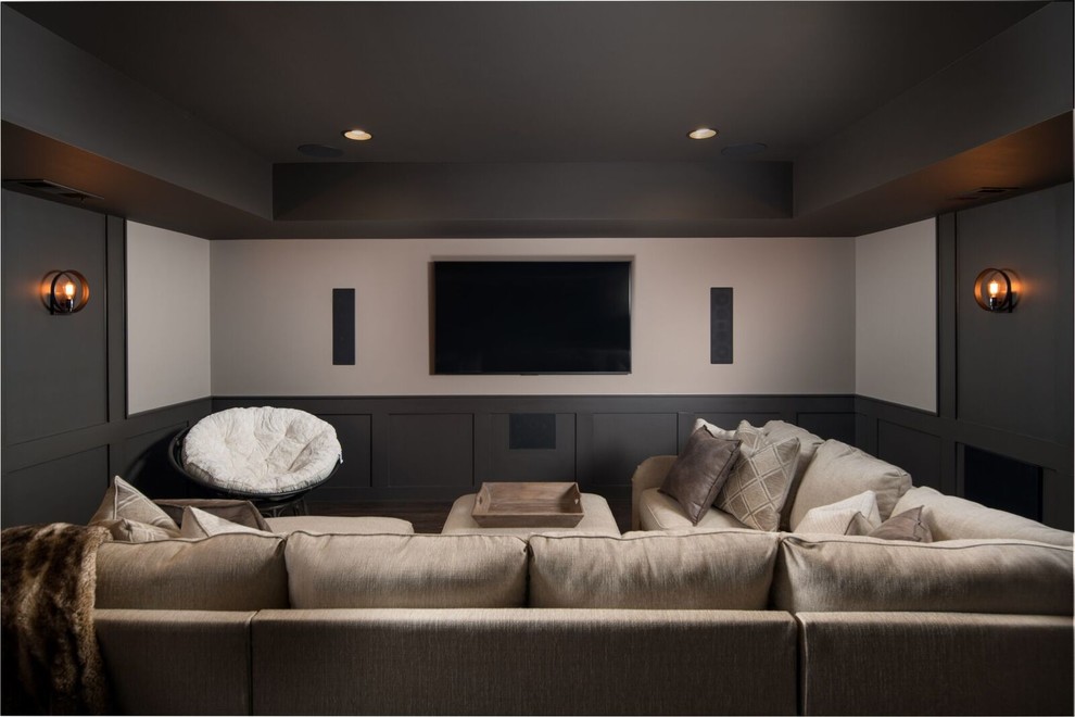 Photo of a transitional enclosed home theatre in Atlanta with a wall-mounted tv.