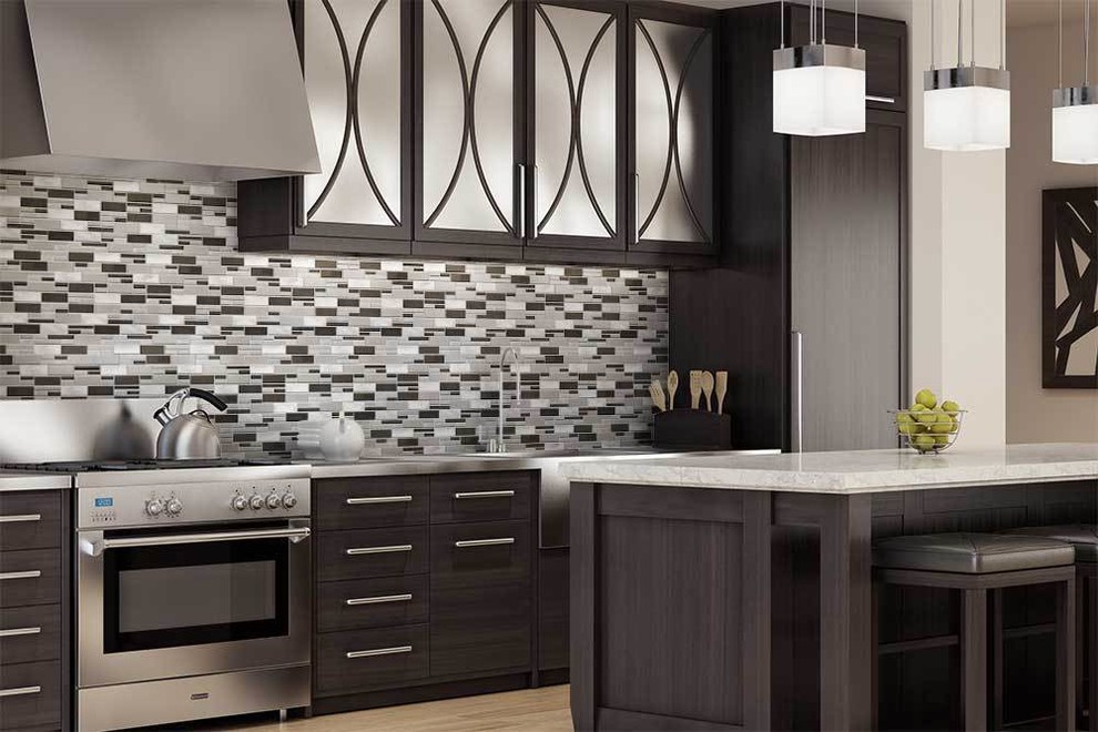 Inspiration for a large modern l-shaped separate kitchen in Miami with an undermount sink, flat-panel cabinets, stainless steel cabinets, stainless steel benchtops, multi-coloured splashback, matchstick tile splashback, panelled appliances, light hardwood floors, with island, brown floor and grey benchtop.