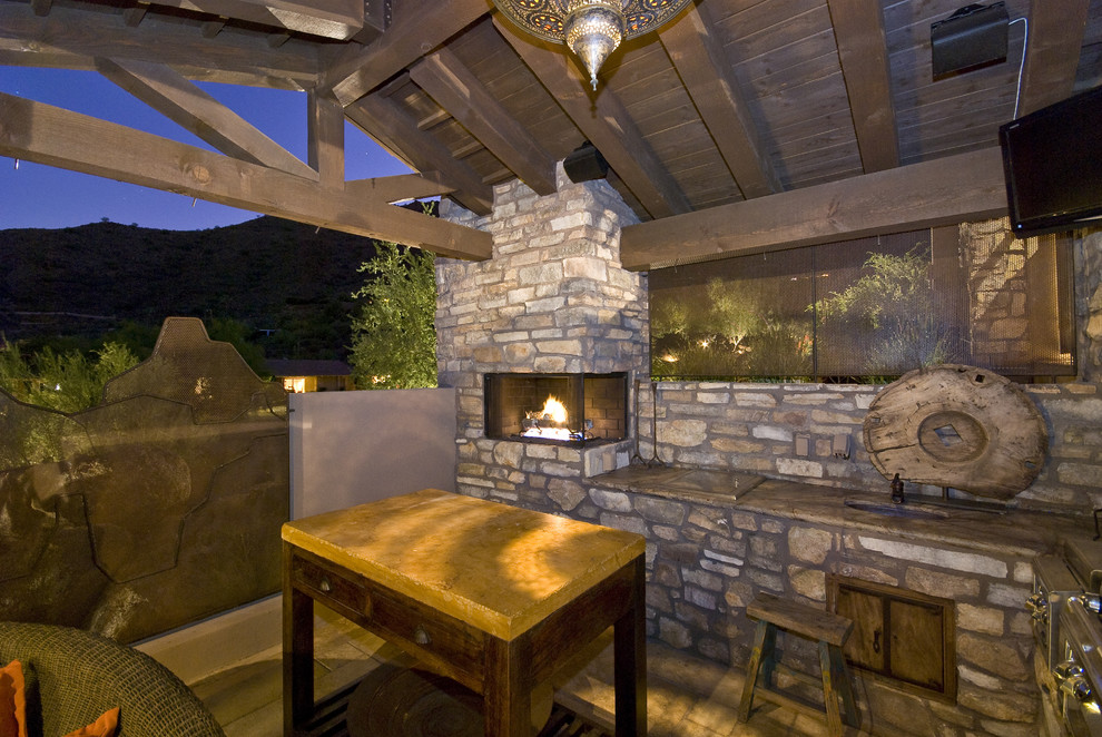 Inspiration for a country patio in Phoenix with a fire feature.