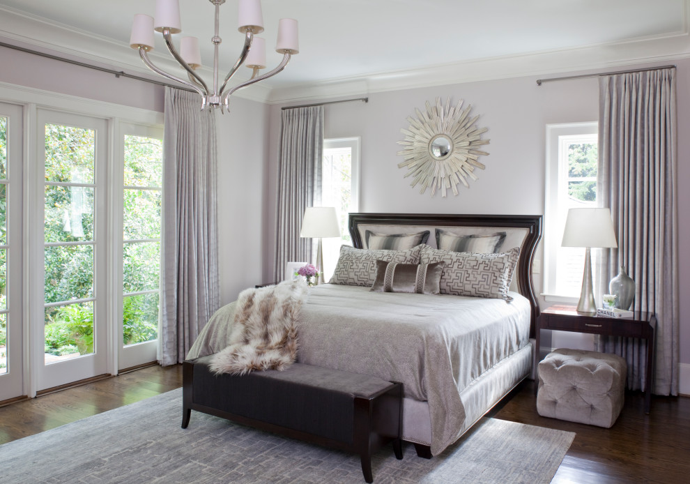 This is an example of a transitional bedroom in Atlanta with grey walls, dark hardwood floors and brown floor.