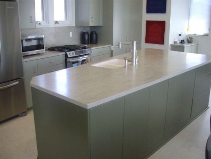 Example of a ceramic tile kitchen design in Denver with gray cabinets, granite countertops, stone slab backsplash and an island