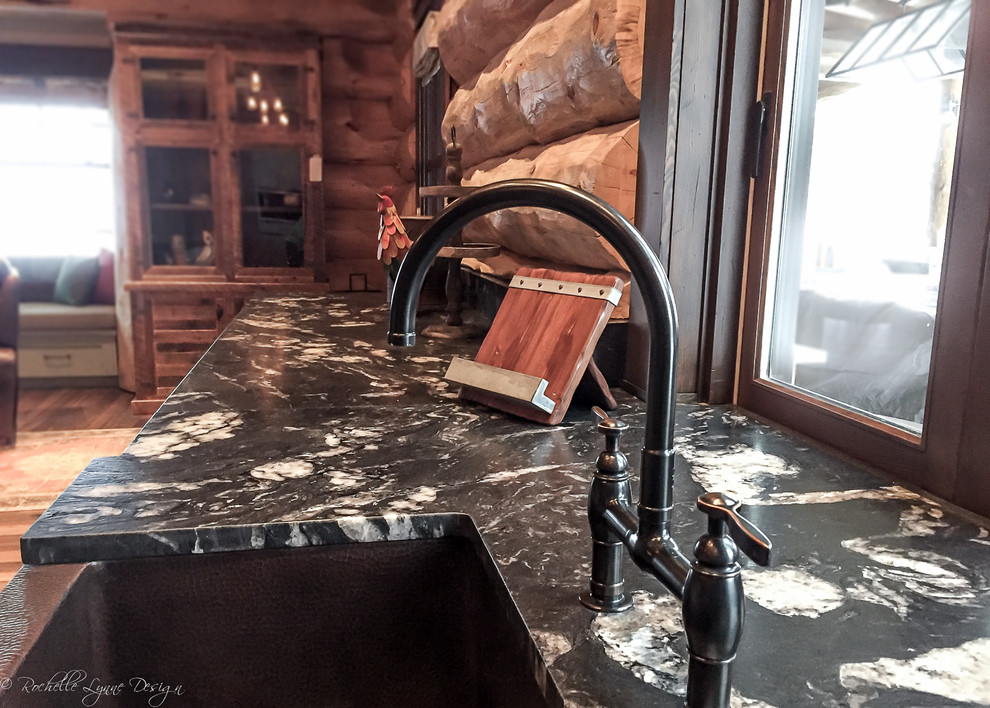 Open concept kitchen - rustic l-shaped medium tone wood floor open concept kitchen idea in Calgary with a farmhouse sink, shaker cabinets, distressed cabinets, granite countertops and two islands
