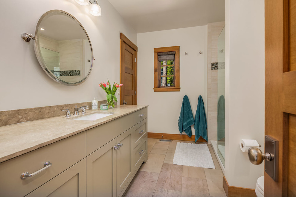 Design ideas for a mid-sized contemporary master wet room bathroom in Seattle with flat-panel cabinets, beige cabinets, a two-piece toilet, multi-coloured tile, mosaic tile, beige walls, marble floors, an undermount sink, granite benchtops and a sliding shower screen.