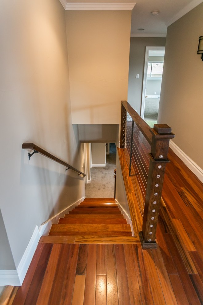 Mid-sized traditional wood straight staircase in Denver with painted wood risers and mixed railing.