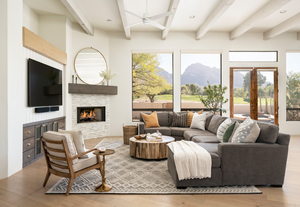 Inspiration for a transitional light wood floor living room remodel in Phoenix with a corner fireplace and a tile fireplace