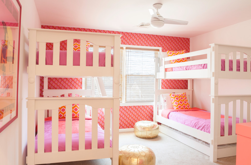 Design ideas for a mid-sized beach style kids' bedroom for kids 4-10 years old and girls in New York with white walls, carpet and beige floor.