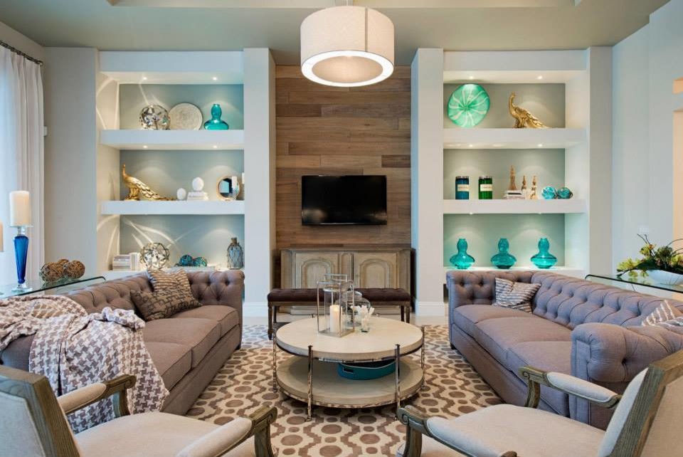 Photo of a large beach style open concept living room in Miami with light hardwood floors and a built-in media wall.
