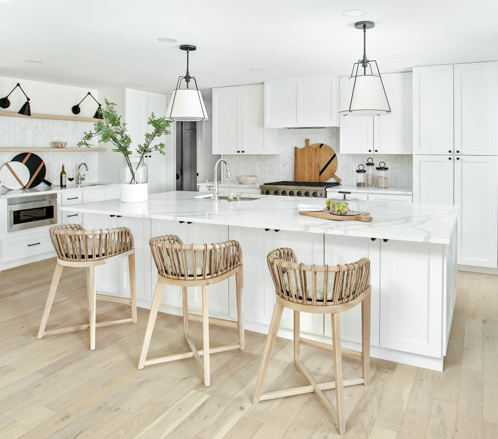 This is an example of an expansive coastal single-wall kitchen/diner in Dallas with an island.