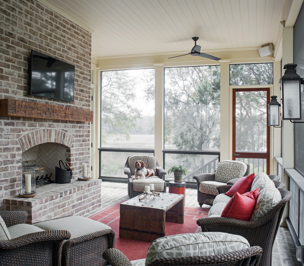 Photo of a country screened-in verandah in Atlanta with brick pavers and a roof extension.