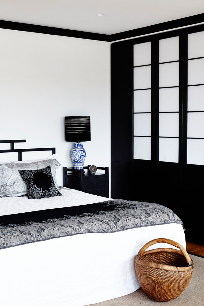 This is an example of a contemporary bedroom in Sydney.