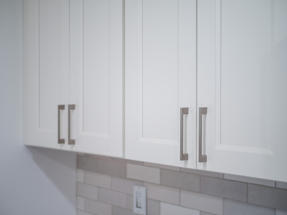 Small transitional galley eat-in kitchen photo in Columbus with shaker cabinets, white cabinets, quartz countertops and white countertops
