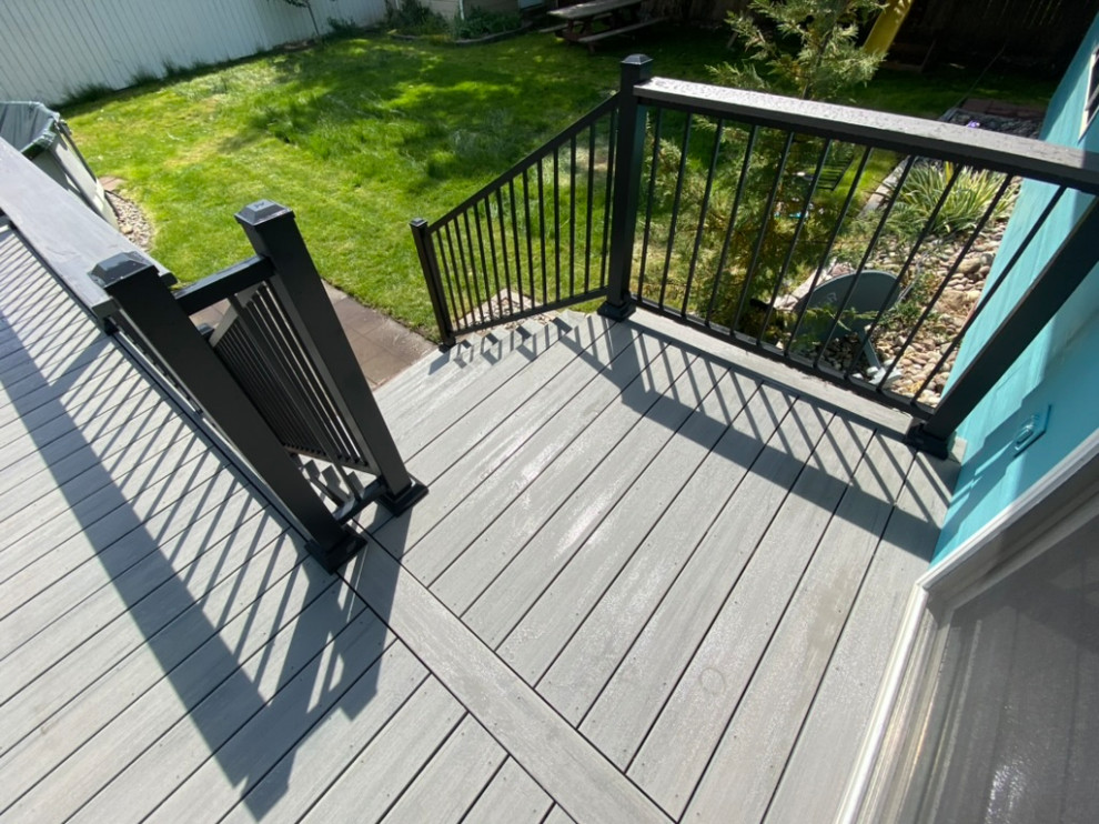 Inspiration for a large backyard metal railing deck remodel in Seattle