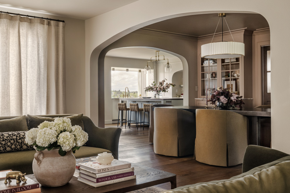 Example of a large classic formal and enclosed medium tone wood floor living room design in Seattle with beige walls, a standard fireplace and no tv