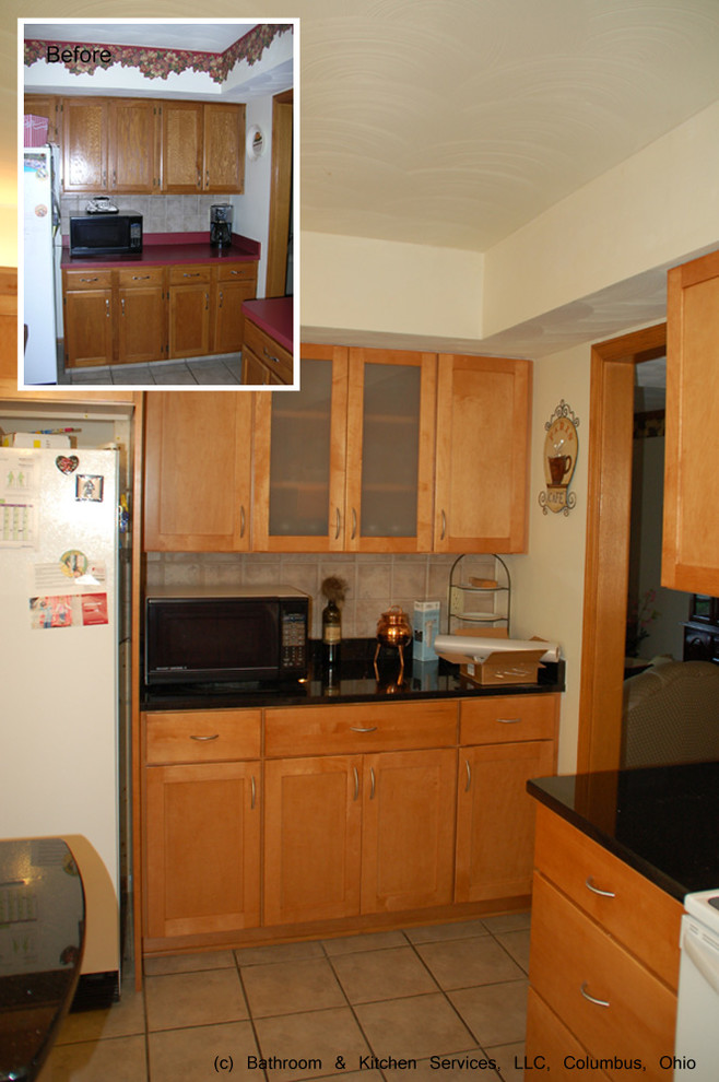 Eat-in kitchen - mid-sized transitional ceramic tile eat-in kitchen idea in Columbus with an undermount sink, granite countertops, brown backsplash, ceramic backsplash, white appliances, an island, flat-panel cabinets and light wood cabinets