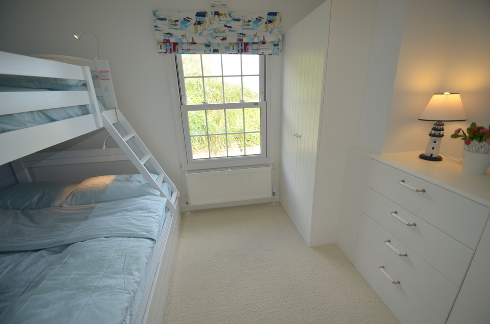 This is an example of a beach style bedroom in Sussex.