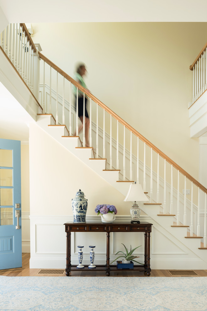 Design ideas for a beach style foyer in Boston with medium hardwood floors, a single front door and a blue front door.