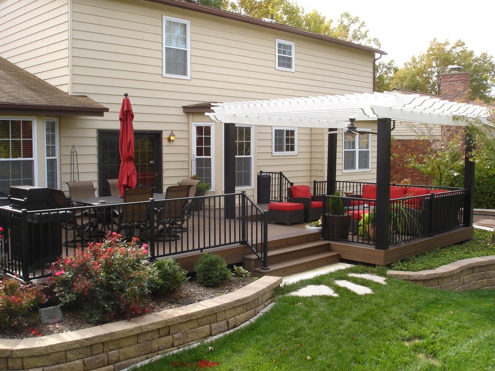 This is an example of a large backyard deck in St Louis with a pergola.