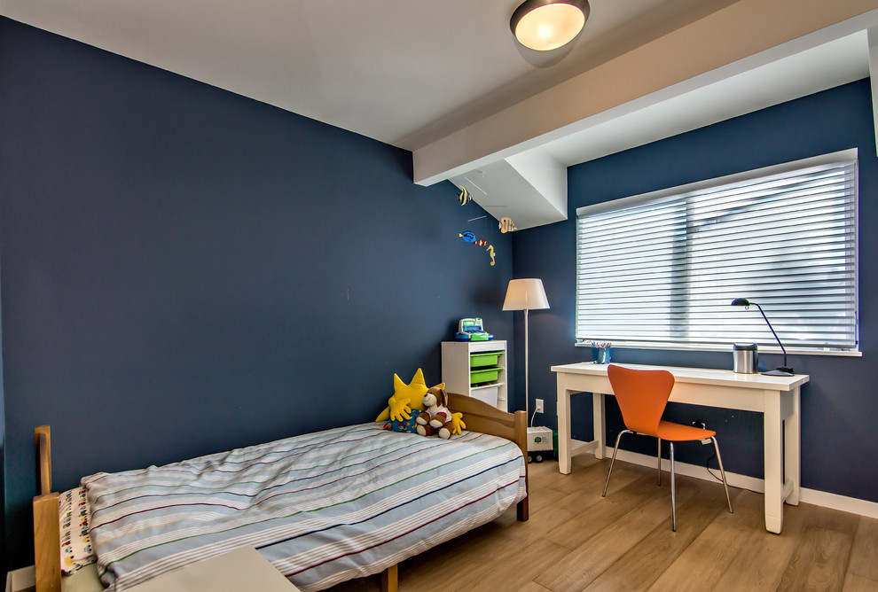 Boy's Bedroom - Kids' study room - study space and mid-sized transitional boy medium tone wood floor kids' study room idea in San Francisco with blue walls