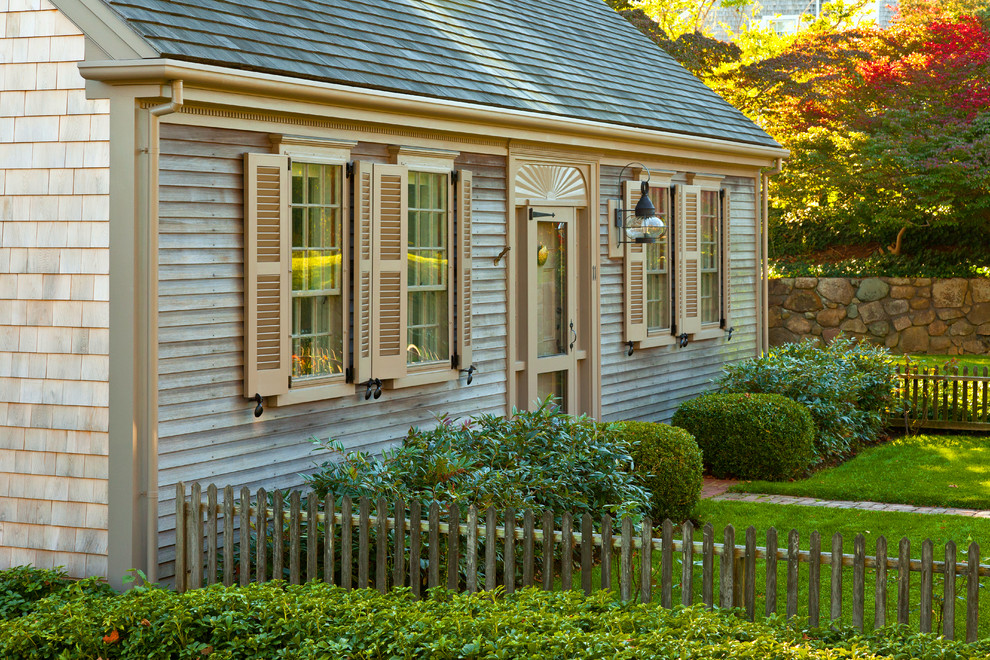 Small traditional exterior in Boston with wood siding and a gable roof.