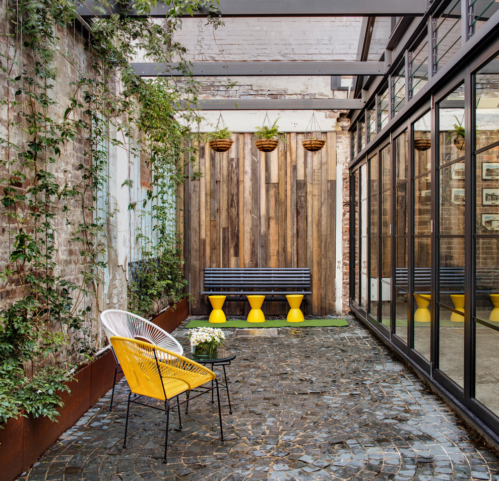 Patio - industrial patio idea in Sydney