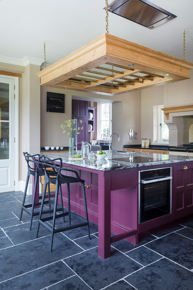 Inspiration for a transitional kitchen in Hampshire with with island.