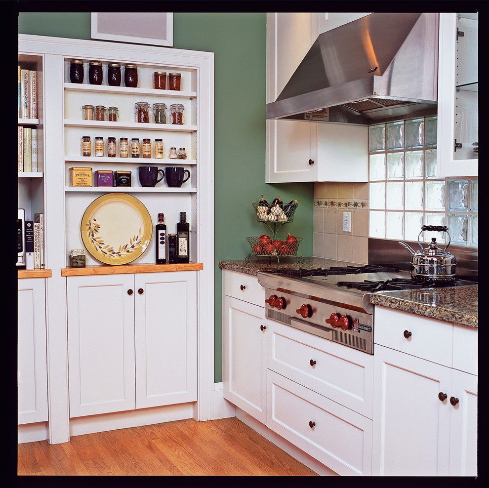 Inspiration for a mid-sized arts and crafts galley eat-in kitchen in San Francisco with an undermount sink, shaker cabinets, white cabinets, granite benchtops, stainless steel appliances, medium hardwood floors and no island.