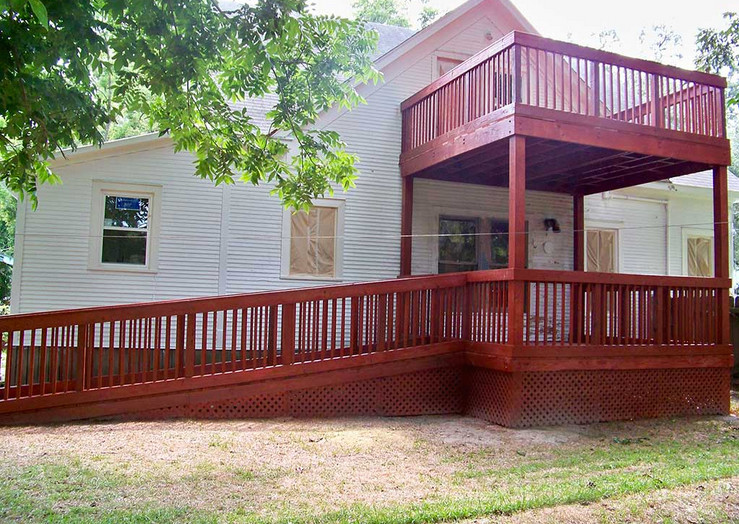 Mid-sized backyard balcony deck photo in Houston with no cover