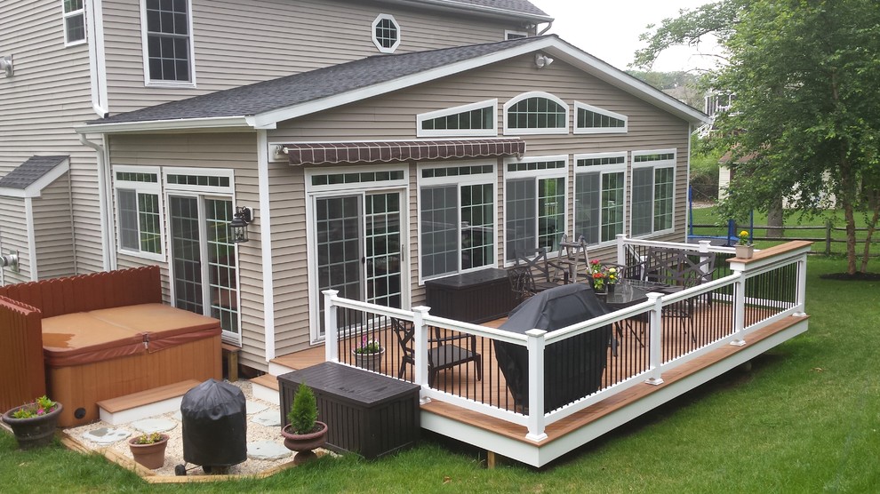 This is an example of a large traditional backyard deck in Baltimore with no cover.