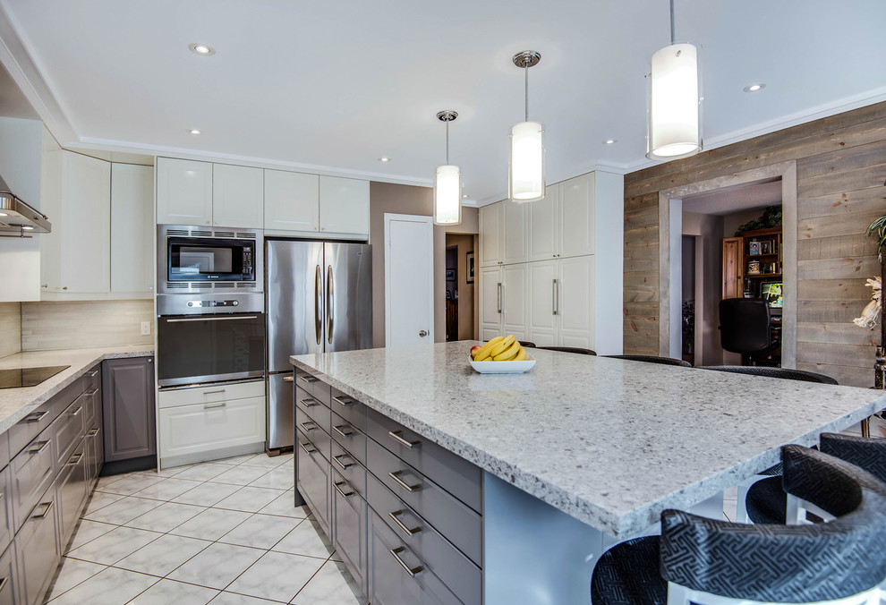 Inspiration for a mid-sized transitional l-shaped separate kitchen in Toronto with an undermount sink, raised-panel cabinets, white cabinets, quartz benchtops, beige splashback, porcelain splashback, stainless steel appliances, ceramic floors and with island.