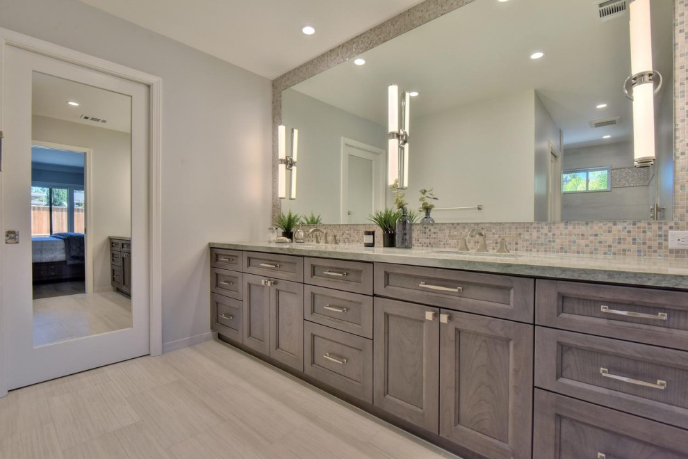 Inspiration for a mid-sized contemporary master bathroom in San Francisco with shaker cabinets, dark wood cabinets, a corner shower, a one-piece toilet, gray tile, glass sheet wall, grey walls, cement tiles, an undermount sink, quartzite benchtops, grey floor, an open shower and orange benchtops.