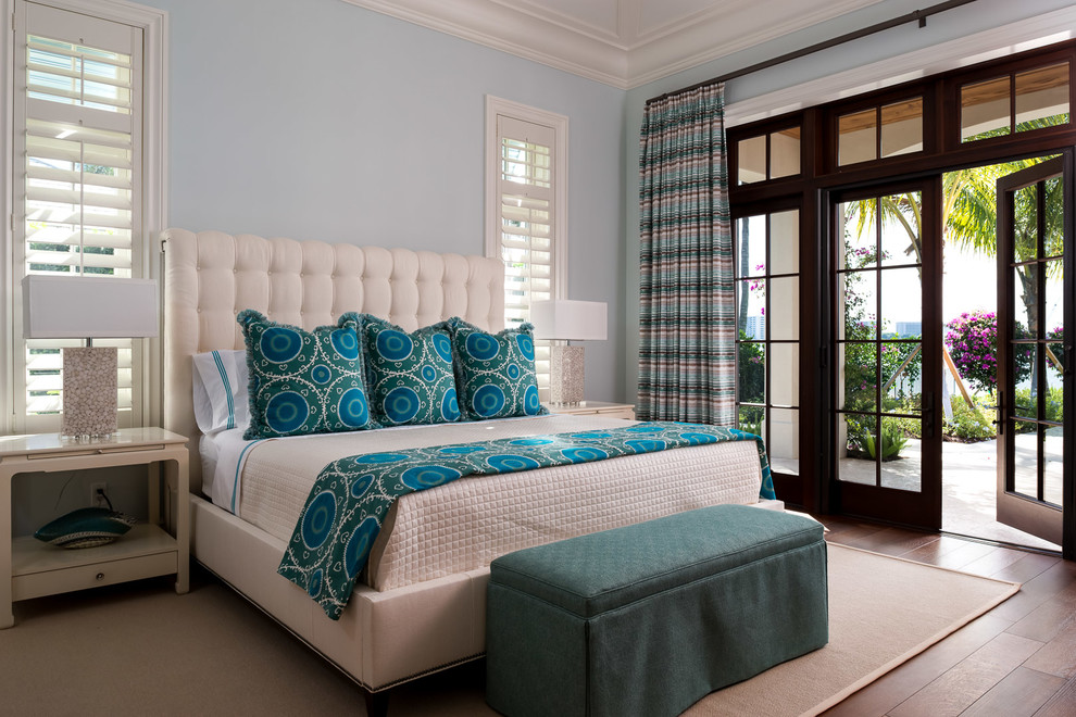 Design ideas for a transitional master bedroom in Miami with blue walls and medium hardwood floors.
