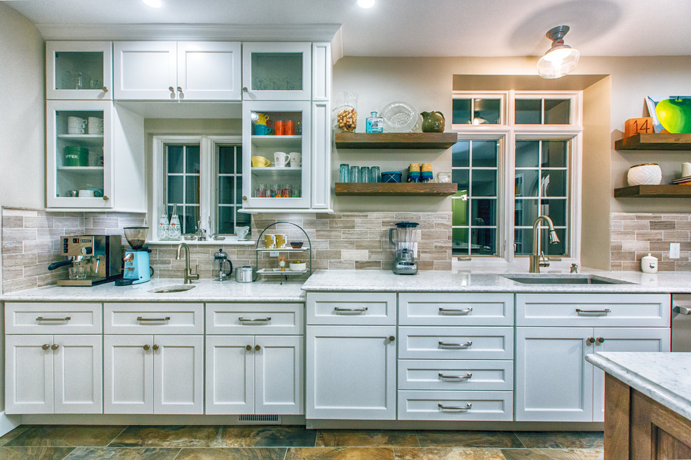 Inspiration for a small transitional kitchen remodel with an undermount sink, beige backsplash, ceramic backsplash, stainless steel appliances and an island