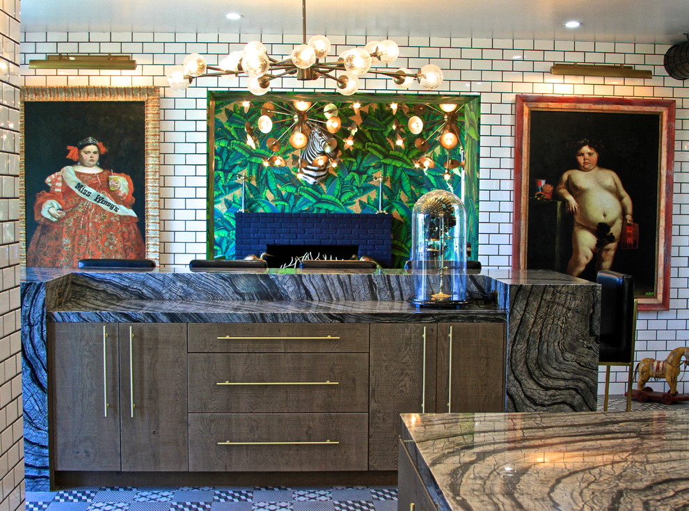 Enclosed kitchen - huge eclectic l-shaped ceramic tile enclosed kitchen idea in Orange County with an undermount sink, flat-panel cabinets, gray cabinets, marble countertops, white backsplash, subway tile backsplash, black appliances and an island
