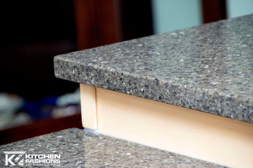 Example of a large trendy u-shaped porcelain tile eat-in kitchen design with an undermount sink, raised-panel cabinets, light wood cabinets, quartzite countertops, multicolored backsplash, porcelain backsplash, stainless steel appliances and a peninsula