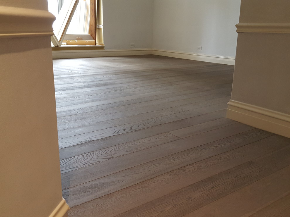 5 and 3/4 inch engineered Bed Rock Oak trowel glued and nailed