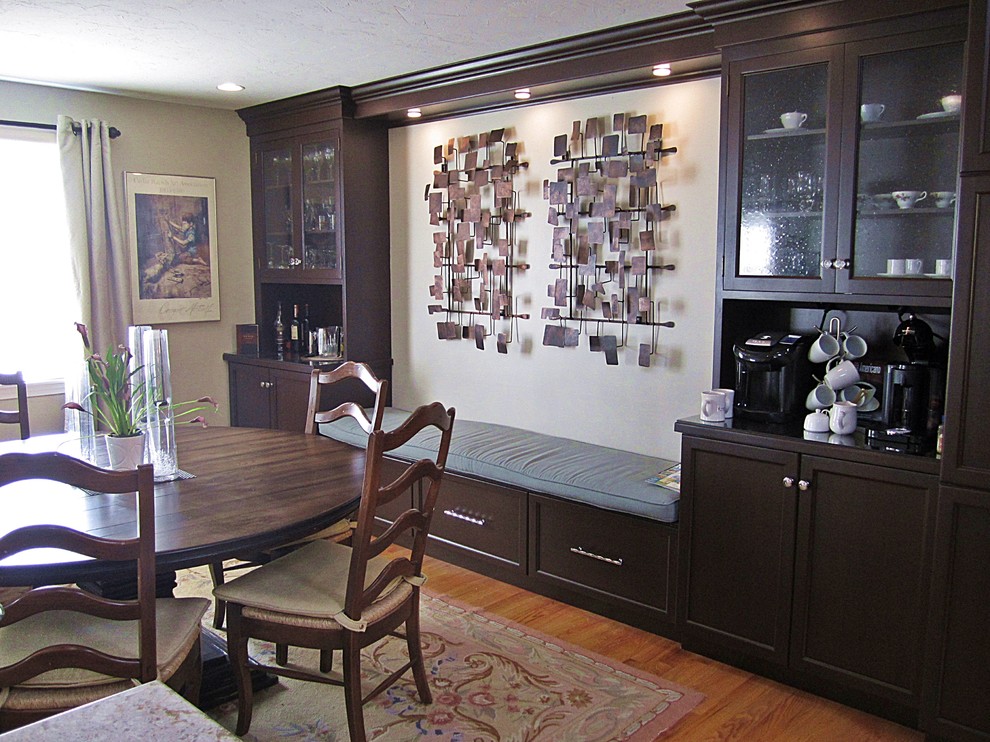 Inspiration for a large transitional l-shaped light wood floor eat-in kitchen remodel with shaker cabinets, black cabinets, marble countertops, white backsplash, subway tile backsplash, stainless steel appliances and an island
