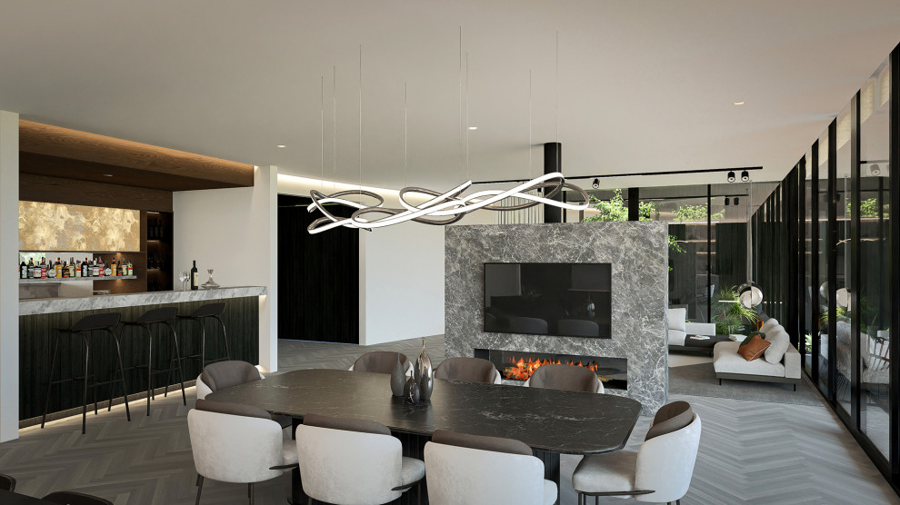 Inspiration for a large modern kitchen/dining combo in Perth with white walls, light hardwood floors, a two-sided fireplace, a stone fireplace surround, brown floor, recessed and decorative wall panelling.