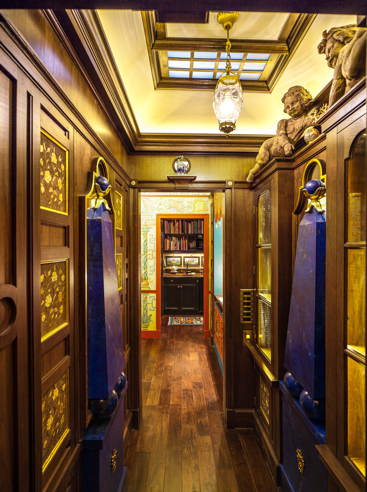 This is an example of an asian hallway in Chicago with dark hardwood floors.