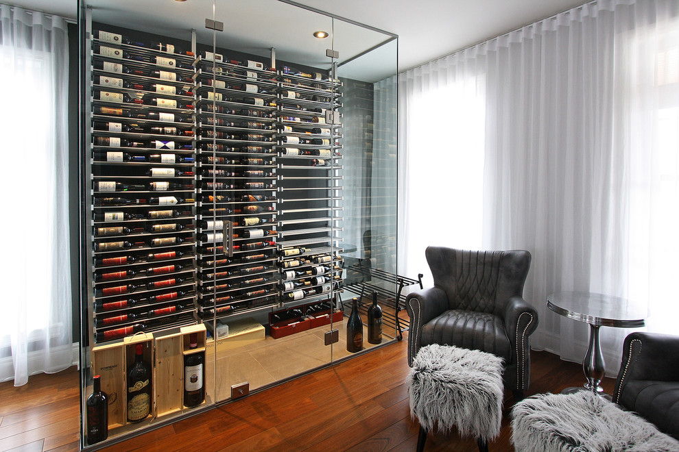 Design ideas for a mid-sized contemporary wine cellar in Phoenix with display racks, ceramic floors and beige floor.