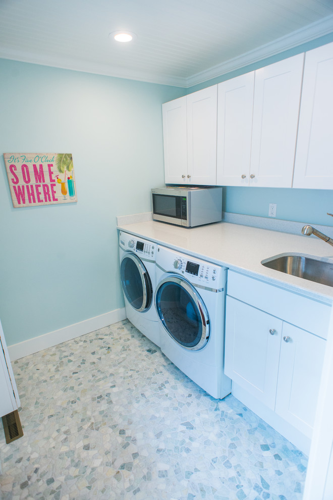 Photo of a beach style laundry room in Providence.