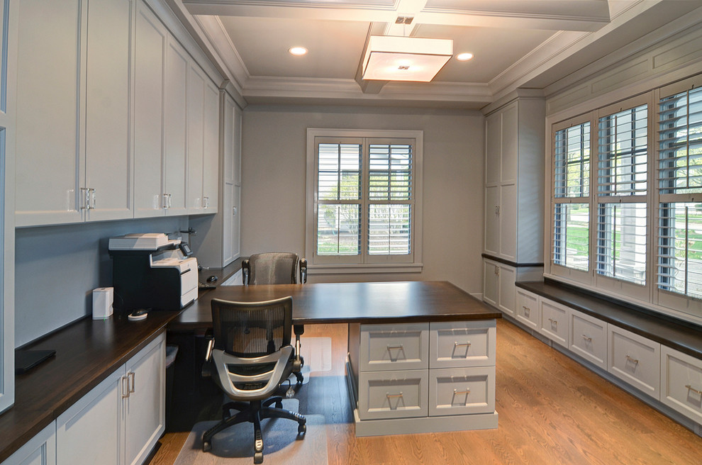 Example of a transitional home office design in Chicago