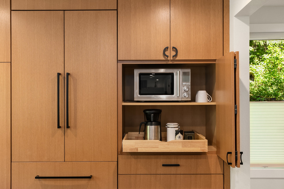 Example of a large 1960s u-shaped medium tone wood floor and brown floor open concept kitchen design in Seattle with an undermount sink, flat-panel cabinets, medium tone wood cabinets, quartzite countertops, multicolored backsplash, porcelain backsplash, stainless steel appliances, an island and multicolored countertops