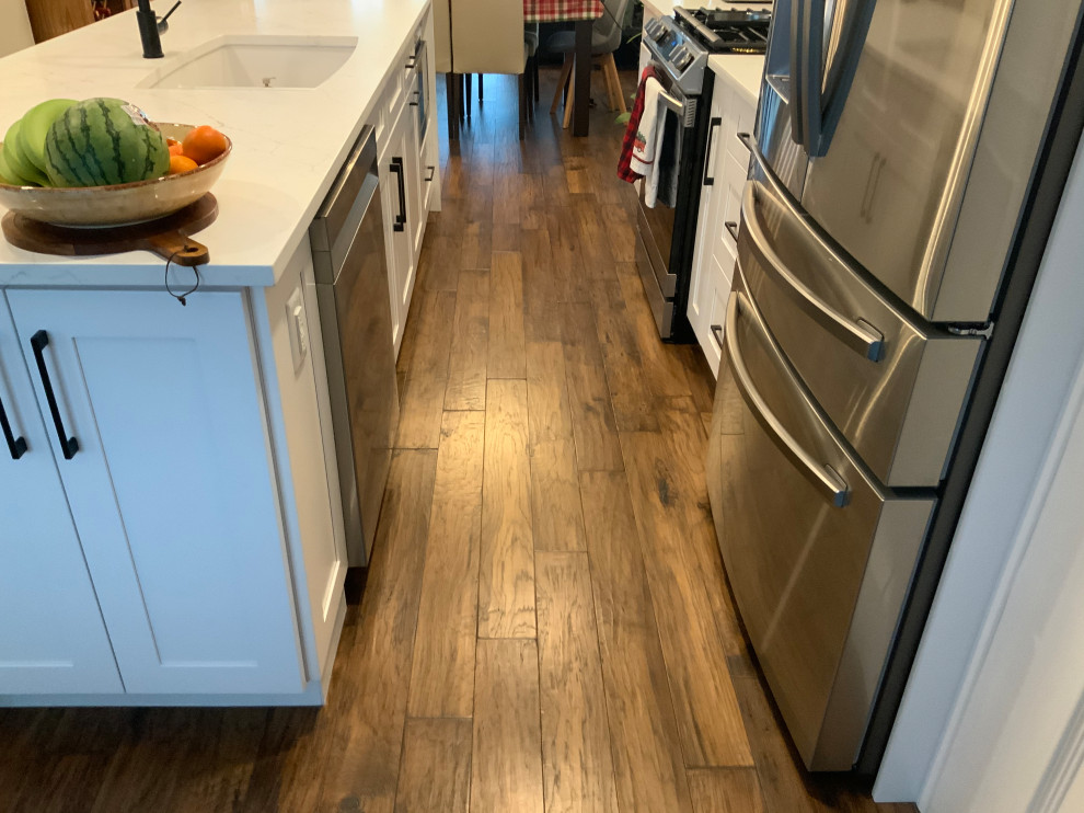 Mid-sized transitional home design photo in Calgary