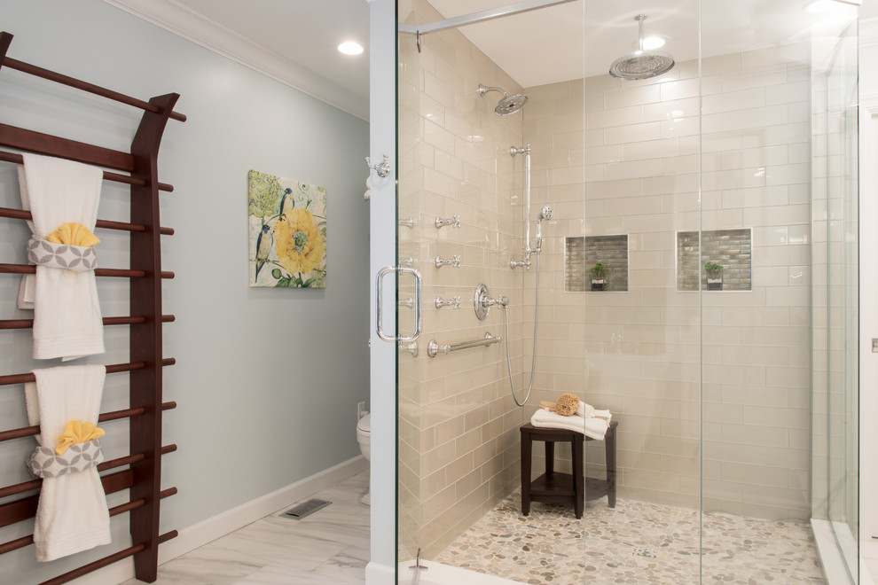 This is an example of a large traditional master bathroom in St Louis with flat-panel cabinets, white cabinets, a freestanding tub, a corner shower, beige tile, subway tile, blue walls, porcelain floors, an undermount sink, engineered quartz benchtops, white floor and a hinged shower door.