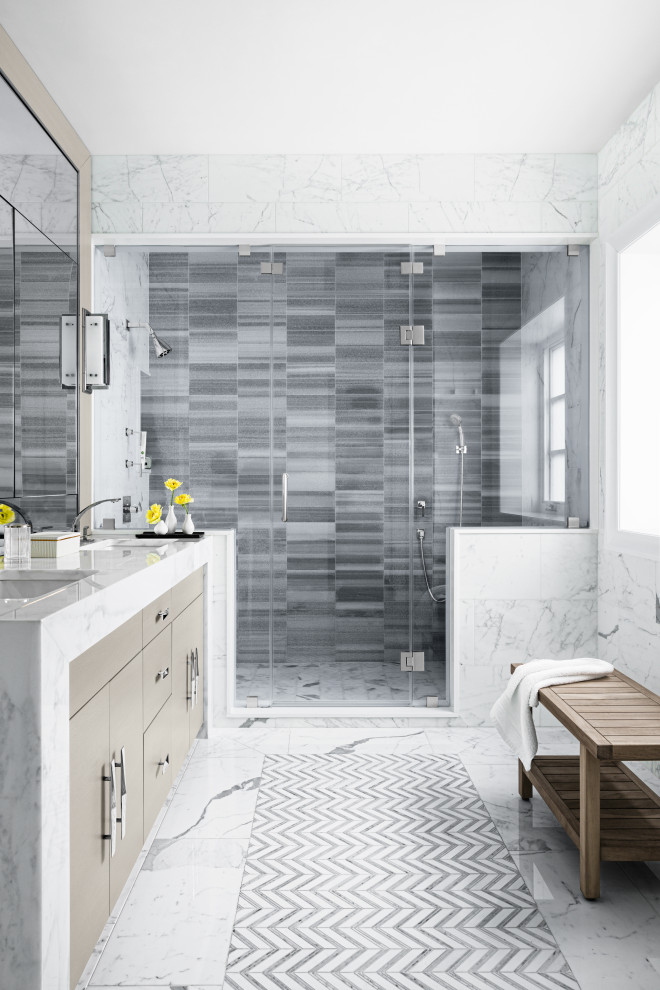 Design ideas for a contemporary bathroom in New York with flat-panel cabinets, beige cabinets, an alcove shower, grey tiles, a submerged sink, white floors, a hinged door, white worktops, double sinks and a built in vanity unit.