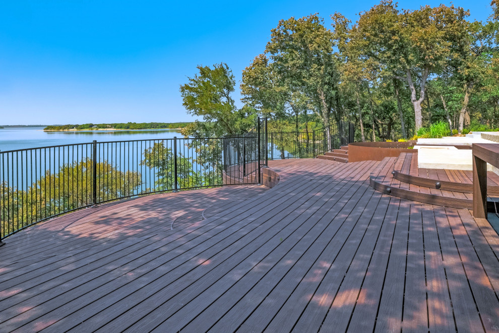 Example of a minimalist backyard ground level deck design