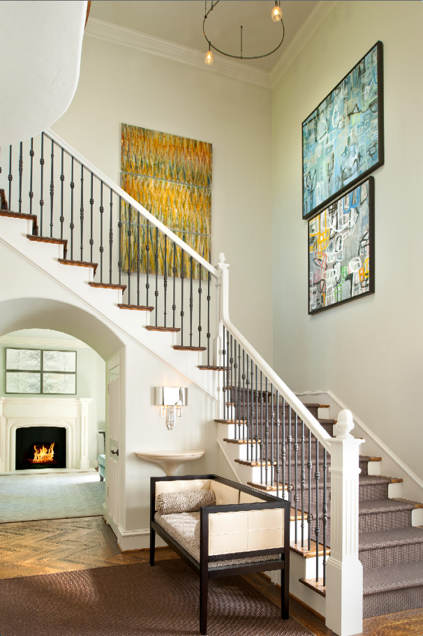 Expansive transitional wood l-shaped staircase in Dallas with painted wood risers.