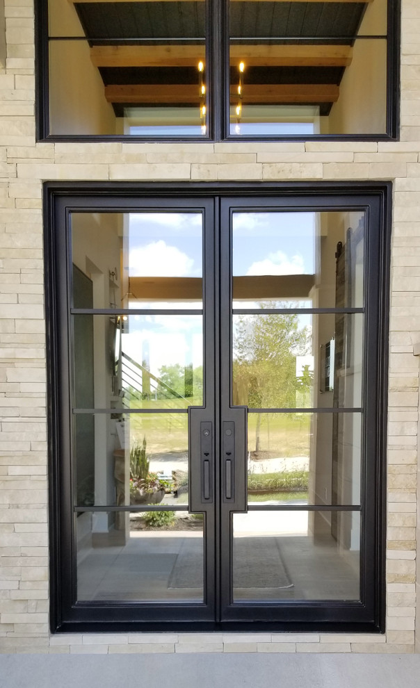 This is an example of a modern front door in Omaha with a double front door and a metal front door.